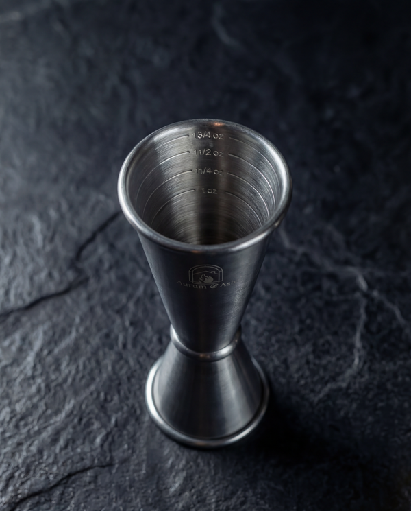 Top-down view of the Jigger showing interior measurement markings at 1/4, 1/2, and 3/4 ounce.