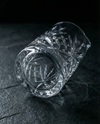 Crystal Mixing Glass on its side, Aurum & Ash logo etched on the base.