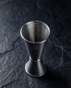 Top-down view of the Jigger showing interior measurement markings at 1/4, 1/2, and 3/4 ounce.